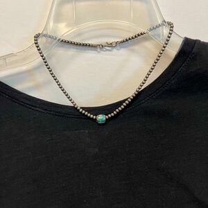 Navajo beads with Turquoise slider. Necklace is 16”.